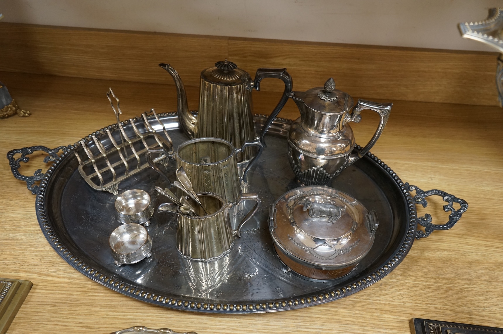 A collection of Victorian plated wares to include a pair of Corinthian column candelabra, 54cm